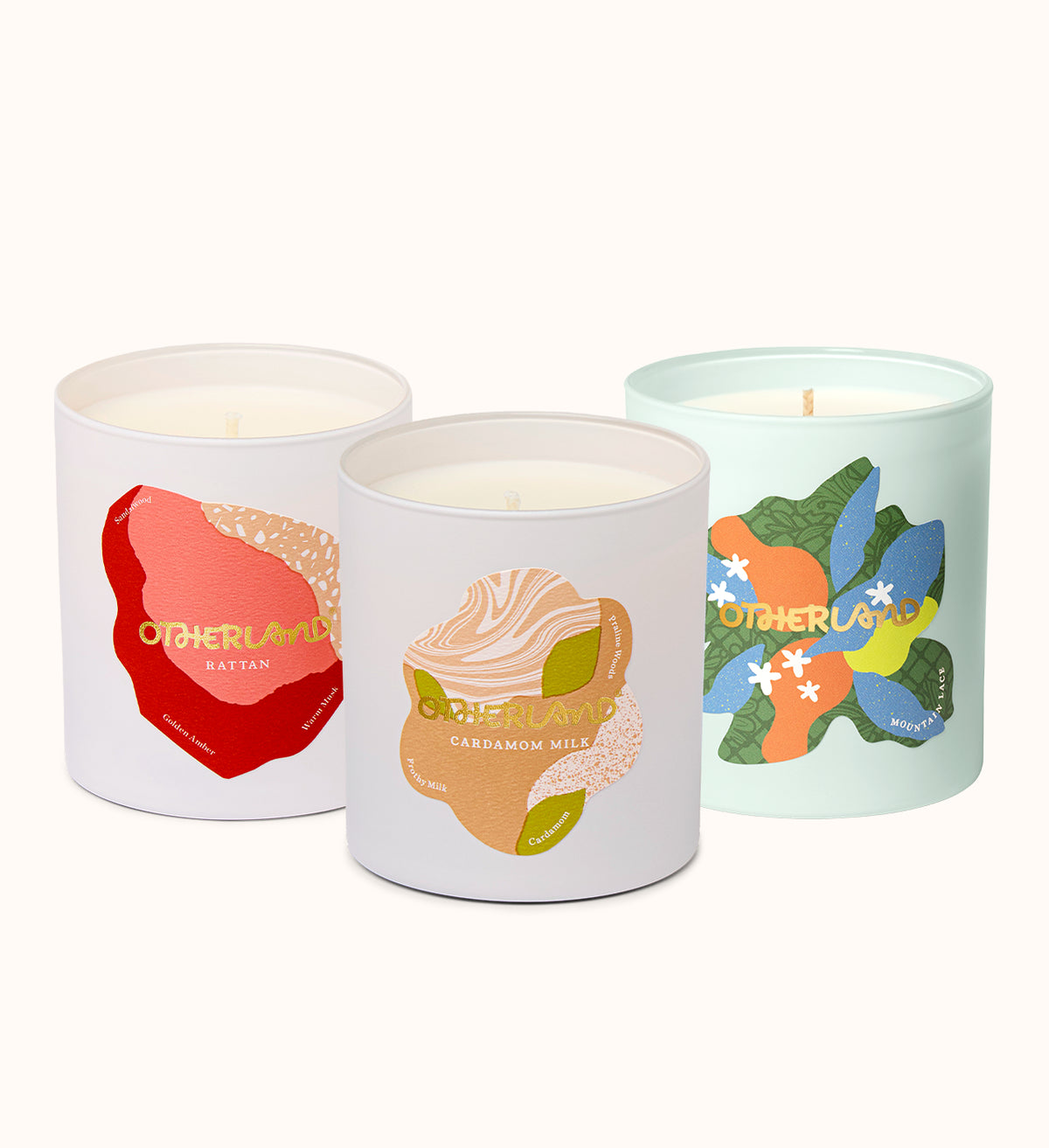 Three candles with colorful labels on a white background