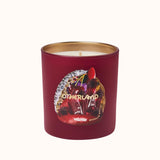 Red candle featuring a decorative label on a white background