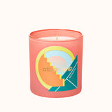 Candle in a pink container with colorful design on a white background