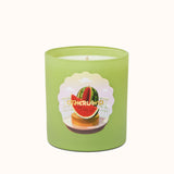 Green candle with watermelon design on a white background