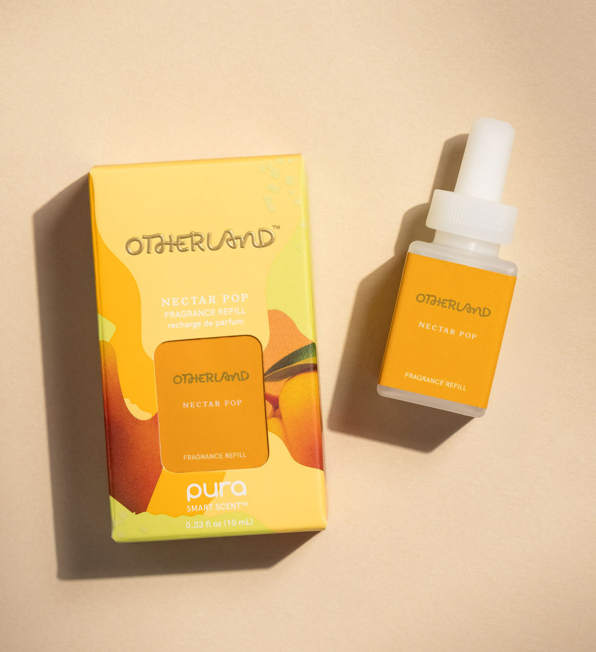 Otherland Nectar Pop fragrance set with packaging and bottle on a beige background